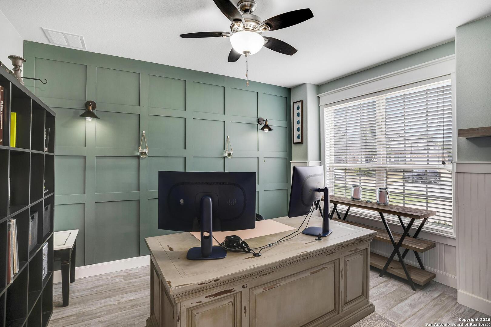 3754 Tumeric Cove Bulverde, TX 78163 - Photo 5 of 42 a room with a table chairs and a ceiling fan