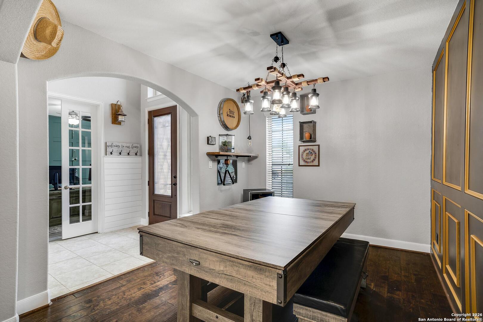 3754 Tumeric Cove Bulverde, TX 78163 - Photo 7 of 42 a view of a dining room with furniture and wooden floor