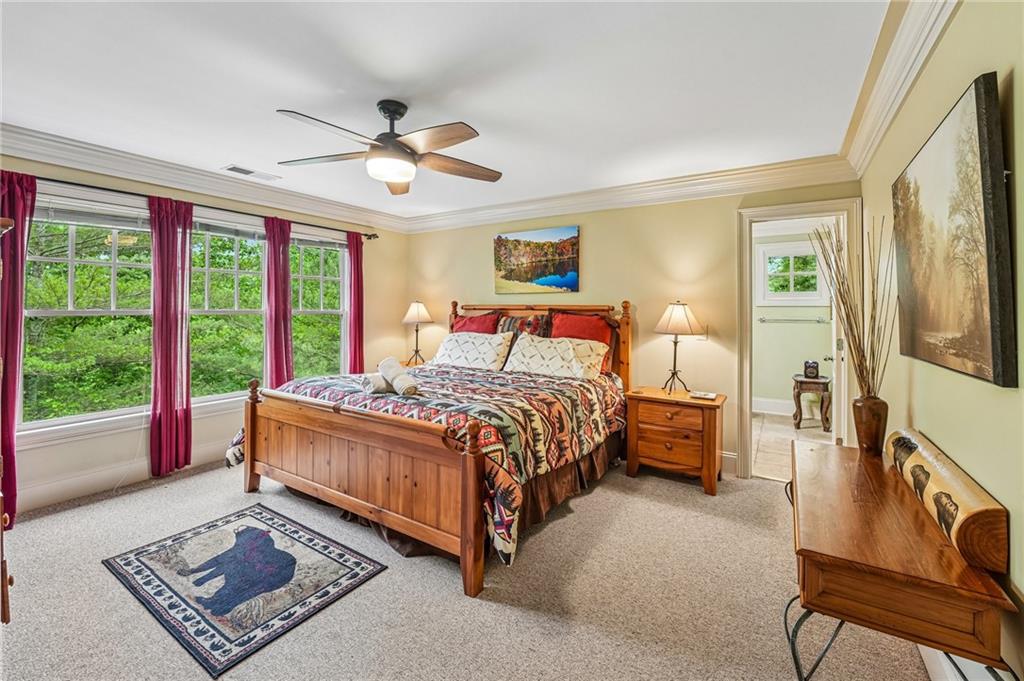 14 Laurel Ridge Lane Big Canoe, GA 30143 - Photo 35 of 72 a bedroom with a large bed and a window