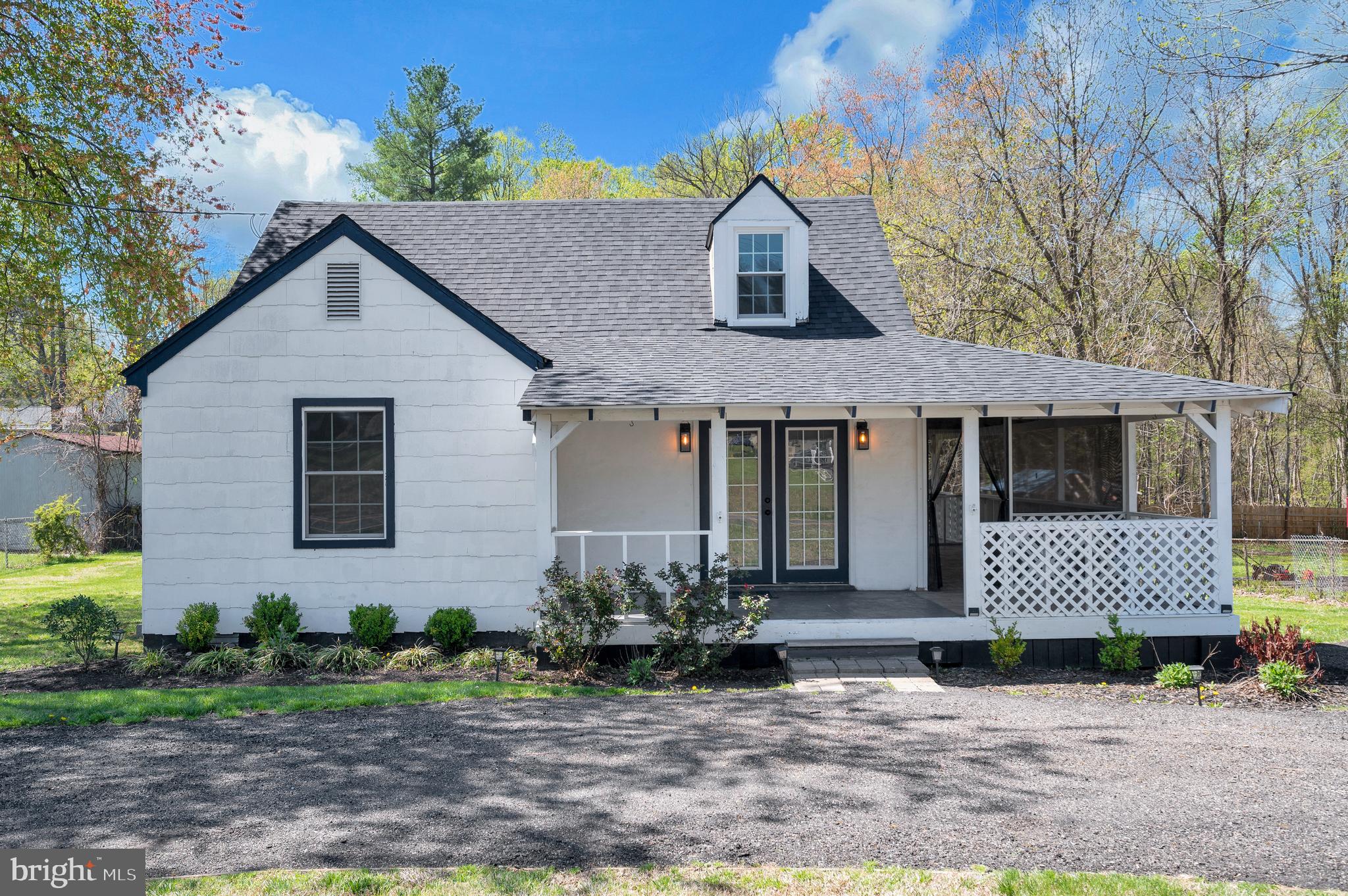 141 Onville Road Stafford, VA 22556 - Photo 11 of 44 a front view of a house with a yard and outdoor seating
