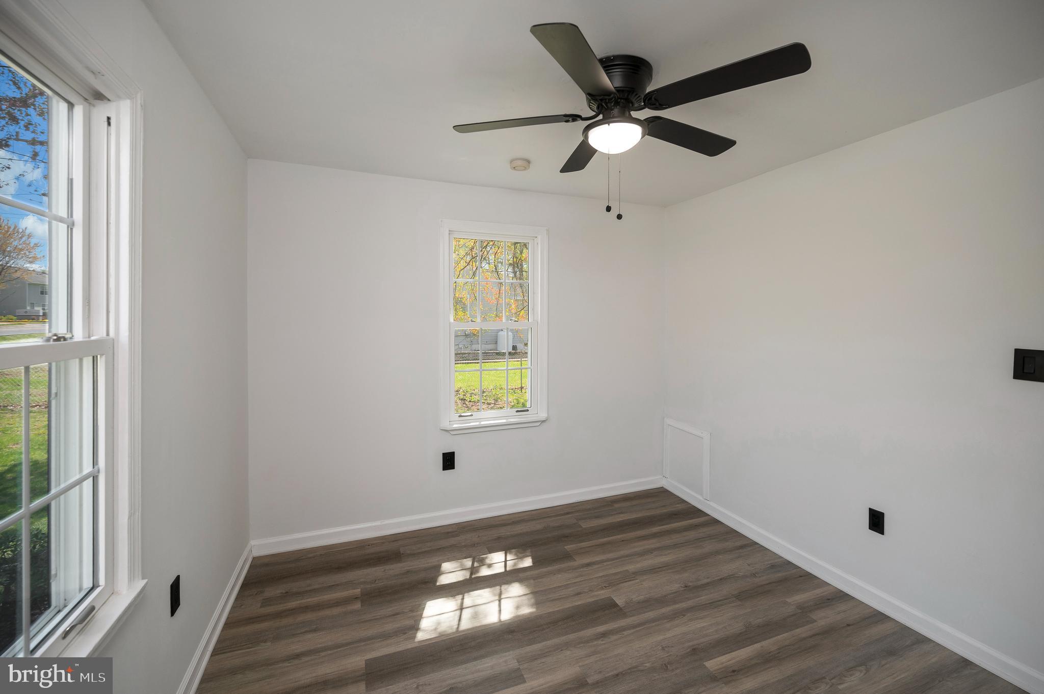 141 Onville Road Stafford, VA 22556 - Photo 14 of 44 a view of an empty room with wooden floor and a window