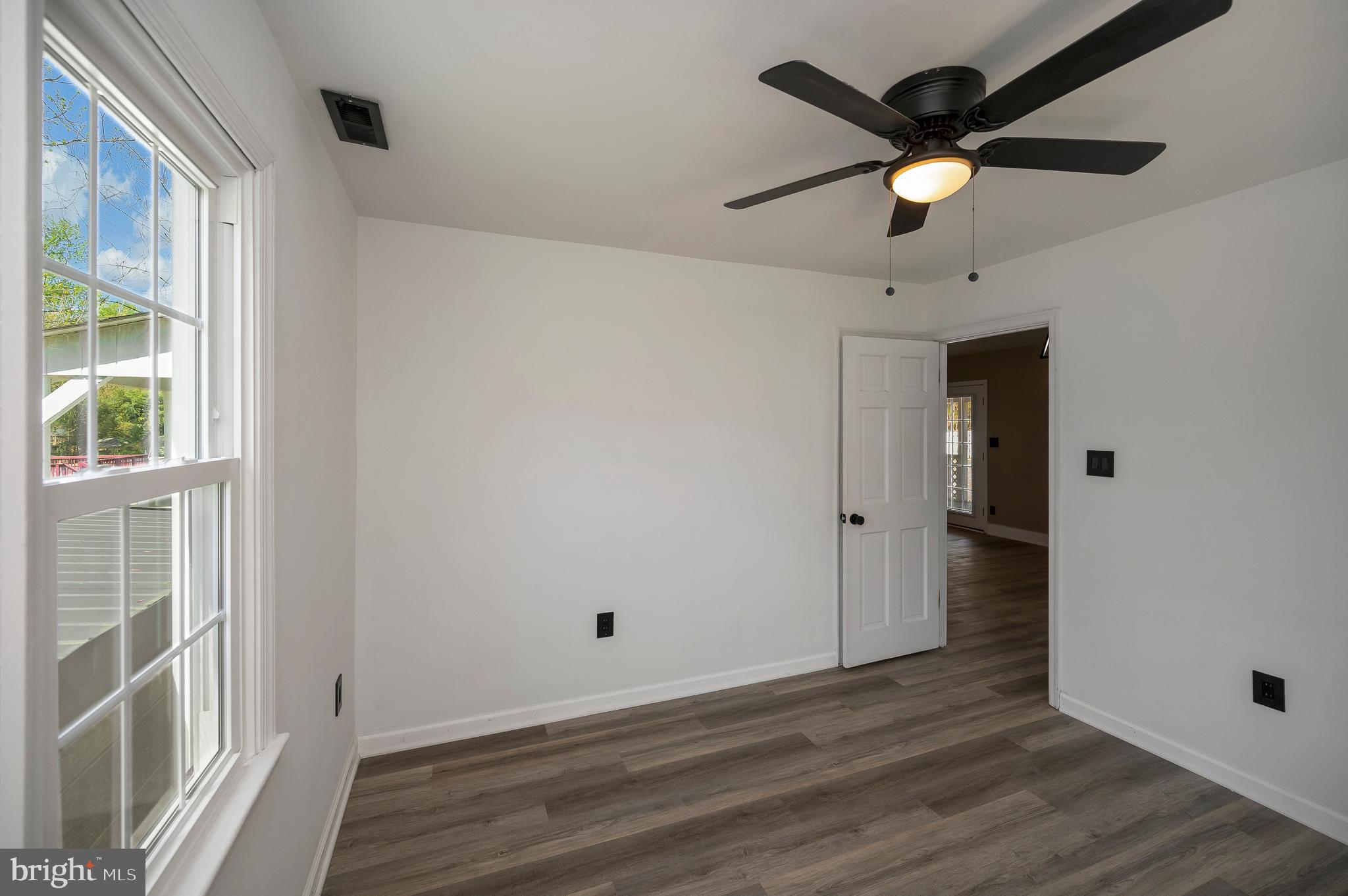 141 Onville Road Stafford, VA 22556 - Photo 25 of 44 an empty room with wooden floor and windows