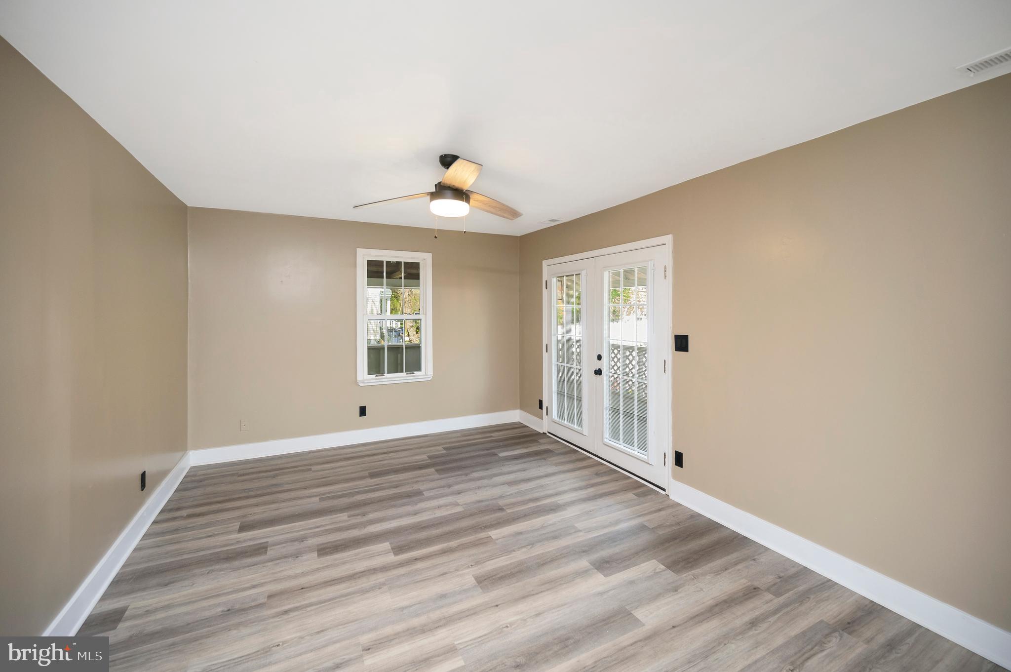 141 Onville Road Stafford, VA 22556 - Photo 30 of 44 a view of an empty room with wooden floor and a window