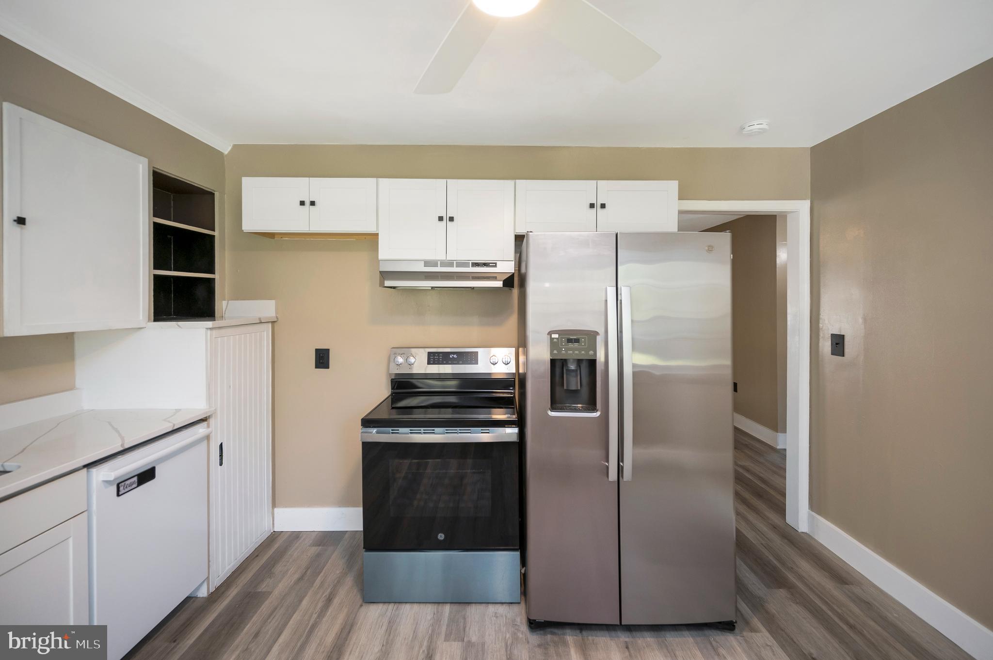 141 Onville Road Stafford, VA 22556 - Photo 6 of 44 a kitchen with stainless steel appliances a refrigerator sink and cabinets