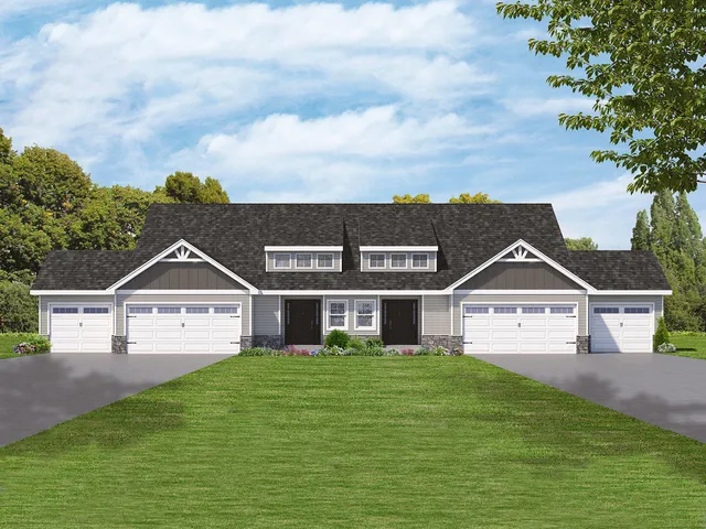 a front view of a house with a garden and yard