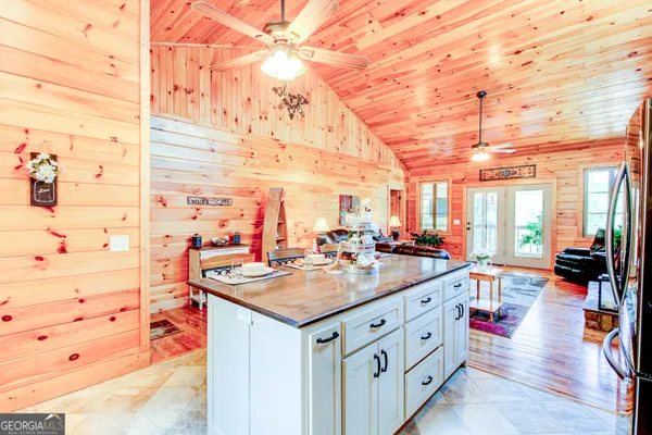 a kitchen with stainless steel appliances granite countertop a stove and a wooden cabinets
