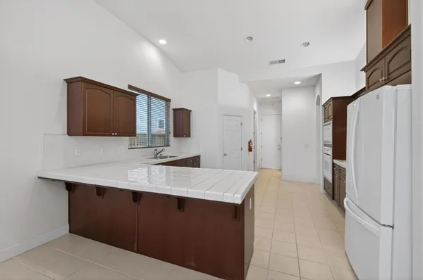 a view of a kitchen with a sink