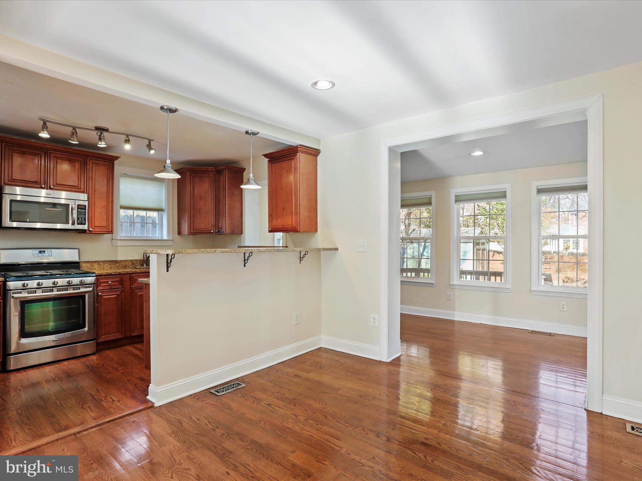808 Malcolm Drive Silver Spring, MD 20901 - Photo 8 of 48 Dining room with views of the chef fixing dinner