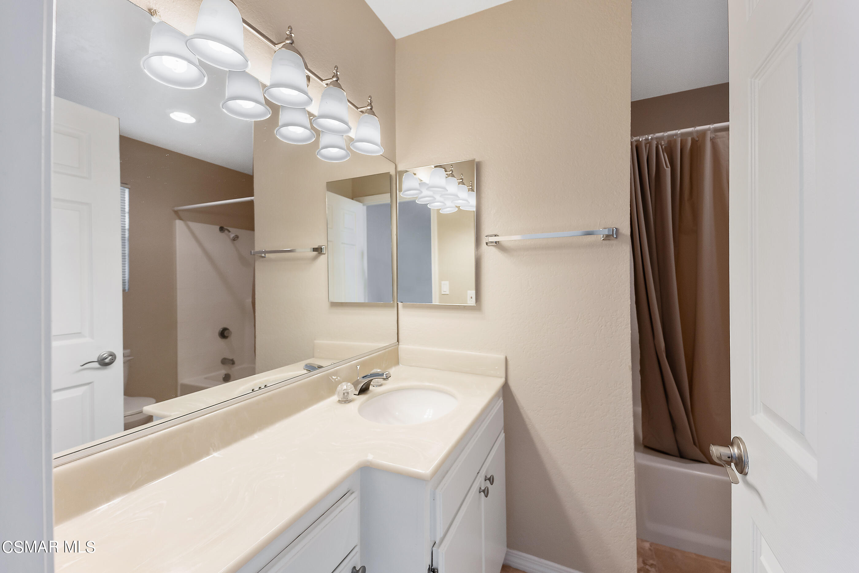 1866 Rory Lane, Unit 1 Simi Valley, CA 93063 - Photo 15 of 25 a bathroom with a sink vanity granite and a mirror