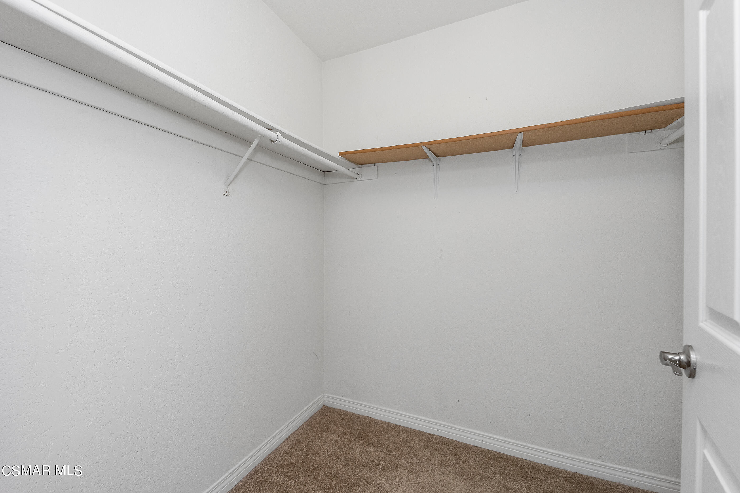 1866 Rory Lane, Unit 1 Simi Valley, CA 93063 - Photo 20 of 25 a view of a room with shelf on the wall