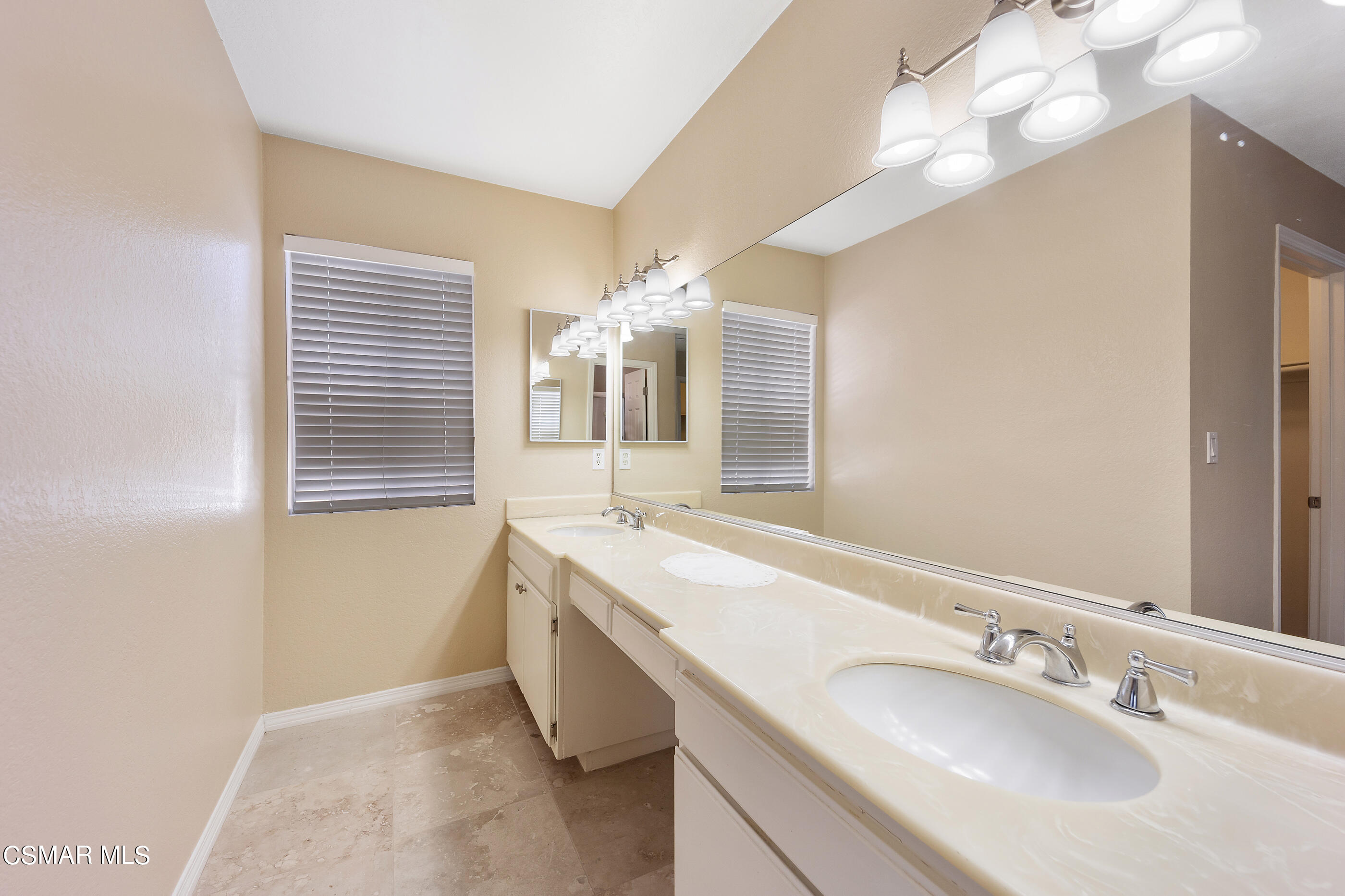 1866 Rory Lane, Unit 1 Simi Valley, CA 93063 - Photo 21 of 25 a bathroom with a granite countertop sink and a mirror