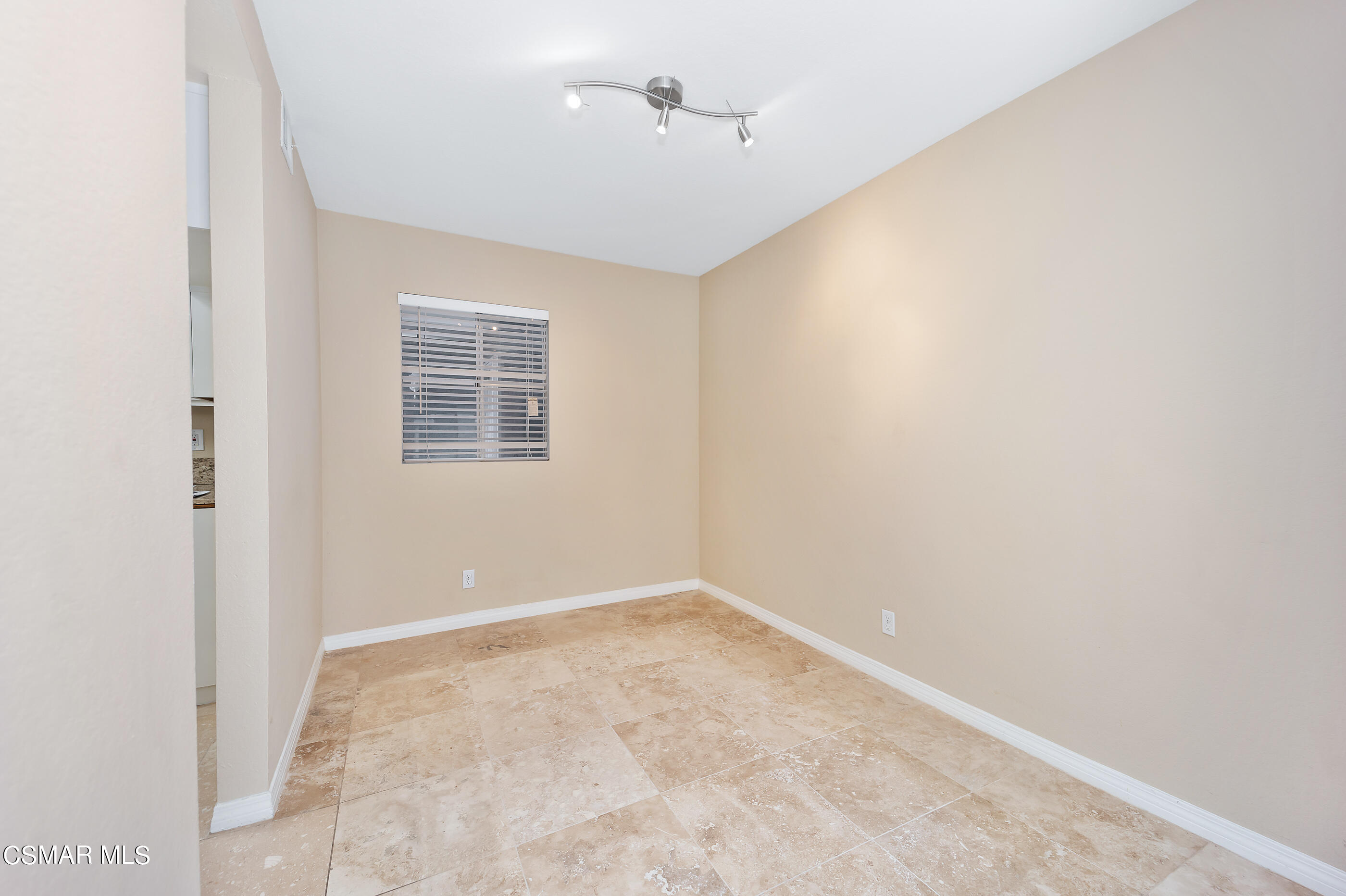 1866 Rory Lane, Unit 1 Simi Valley, CA 93063 - Photo 7 of 25 an empty room with windows and fan