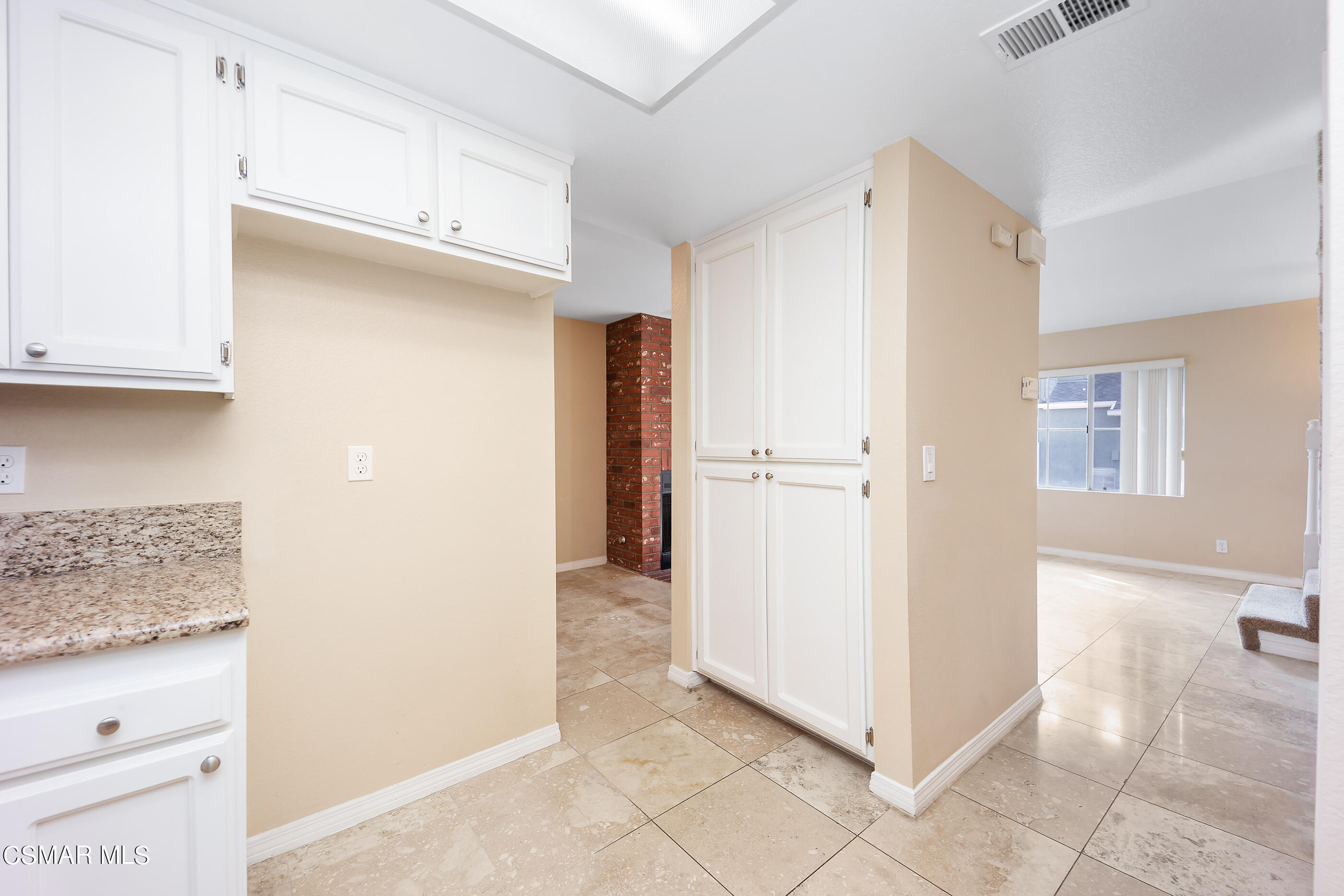 1866 Rory Lane, Unit 1 Simi Valley, CA 93063 - Photo 10 of 25 a view of a kitchen with refrigerator and cabinet