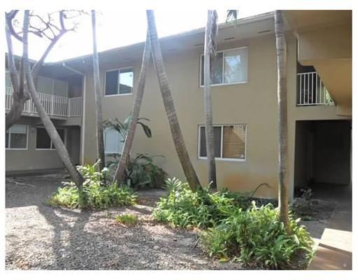 6330 Southwest 79th Street, Unit 23 South Miami, FL 33143 - Photo 2 of 7 a front view of a house with a yard