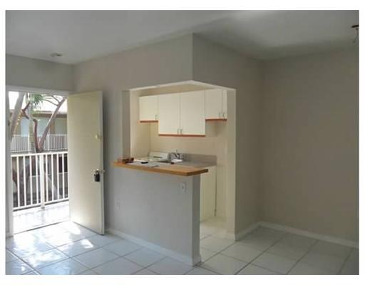6330 Southwest 79th Street, Unit 23 South Miami, FL 33143 - Photo 5 of 7 a kitchen with sink and cabinets