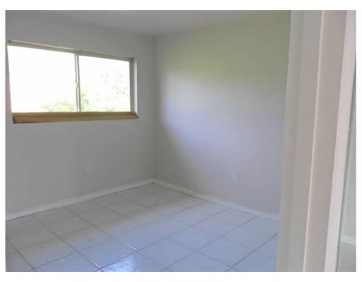 6330 Southwest 79th Street, Unit 23 South Miami, FL 33143 - Photo 6 of 7 a view of an empty room and window