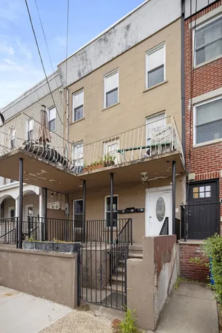a front view of a house with glass windows