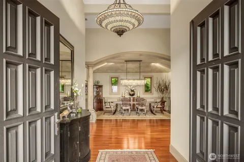a view of a living room and chandelier