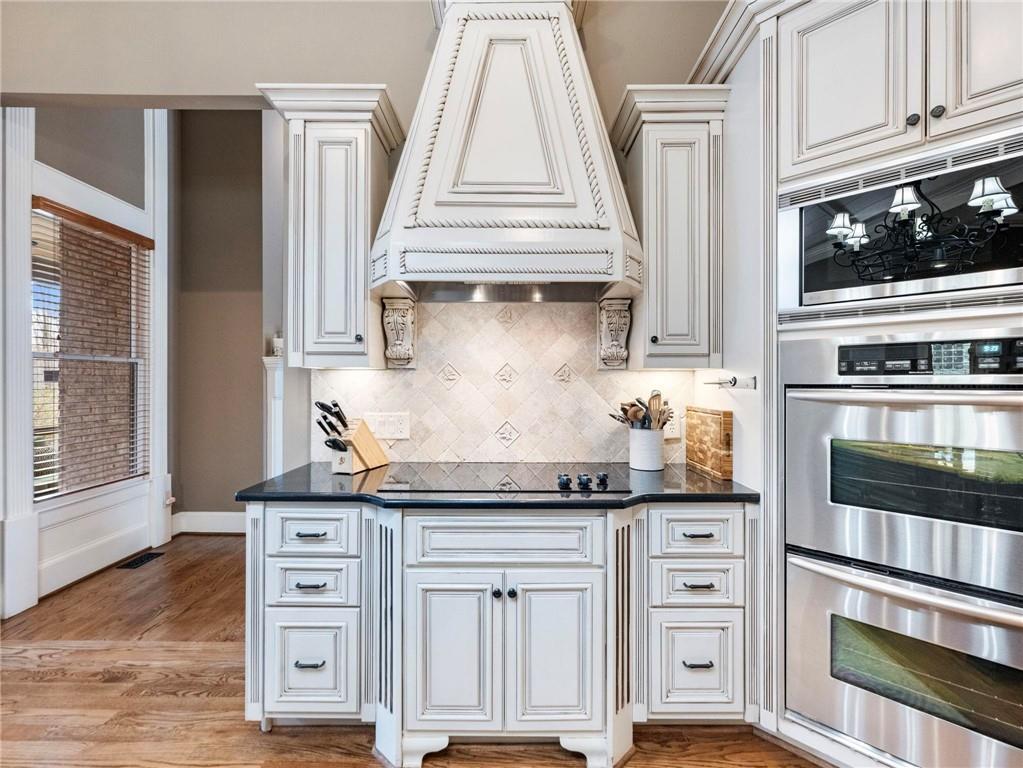 6147 Golf View Court Jefferson, GA 30549 - Photo 19 of 73 a kitchen with stainless steel appliances a stove and a microwave
