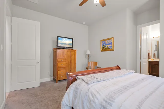 a bedroom with a bed and a lamp