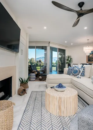 a living room with furniture fireplace and a flat screen tv