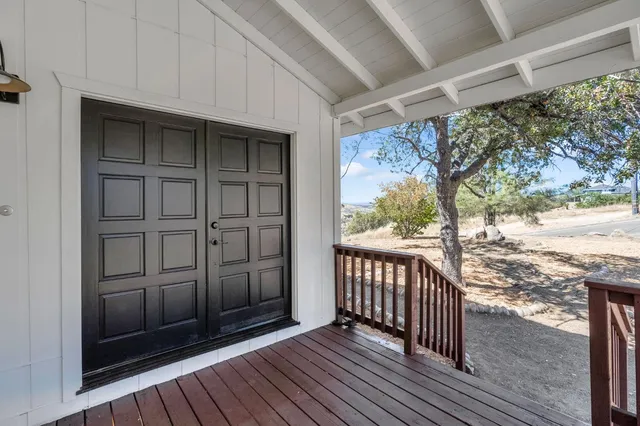 a view of a porch with wooden floor and outdoor space