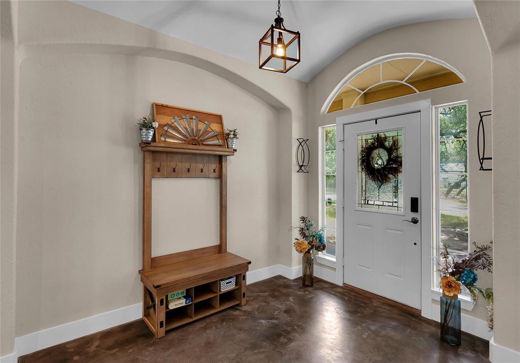 37 Bluebonnet Loop Morgan's Point Resort, TX 76513 - Photo 4 of 38 Entryway featuring a white door with decorative glass, two sidelight windows, and an arched transom window