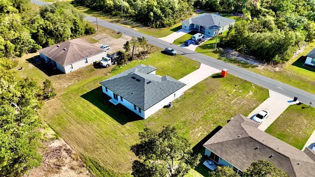 an aerial view of a house with a garden