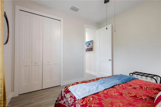 a bedroom with a bed and a dresser