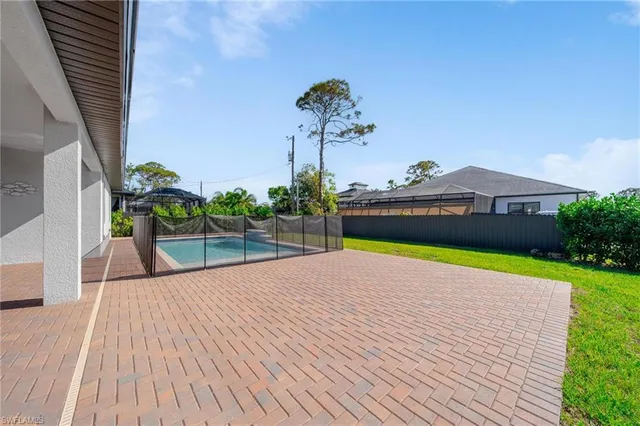a view of swimming pool with seating space
