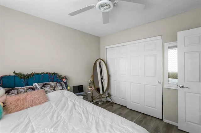 a bed sitting in a bedroom next to a window