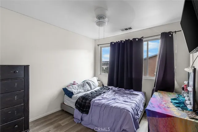 a bedroom with a bed and a mirror