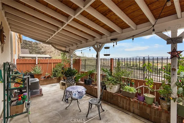 a outdoor living space with patio furniture and potted plants