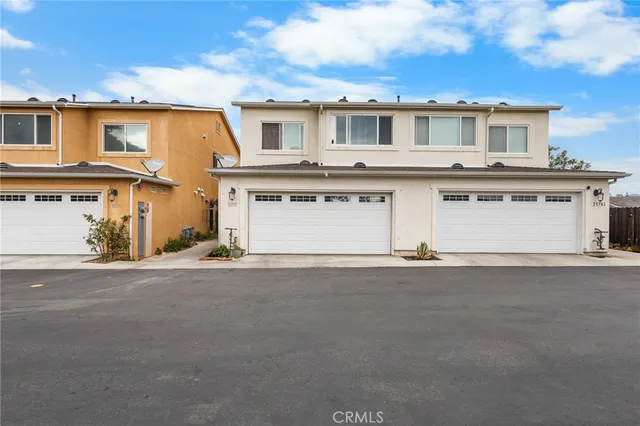 a view of a town with mountains in the background