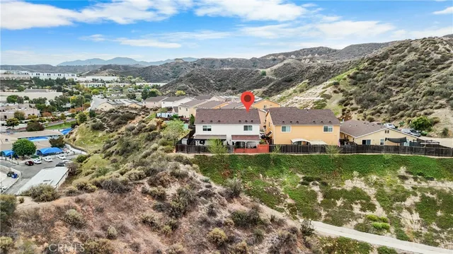 an aerial view of a house with garden space and windows