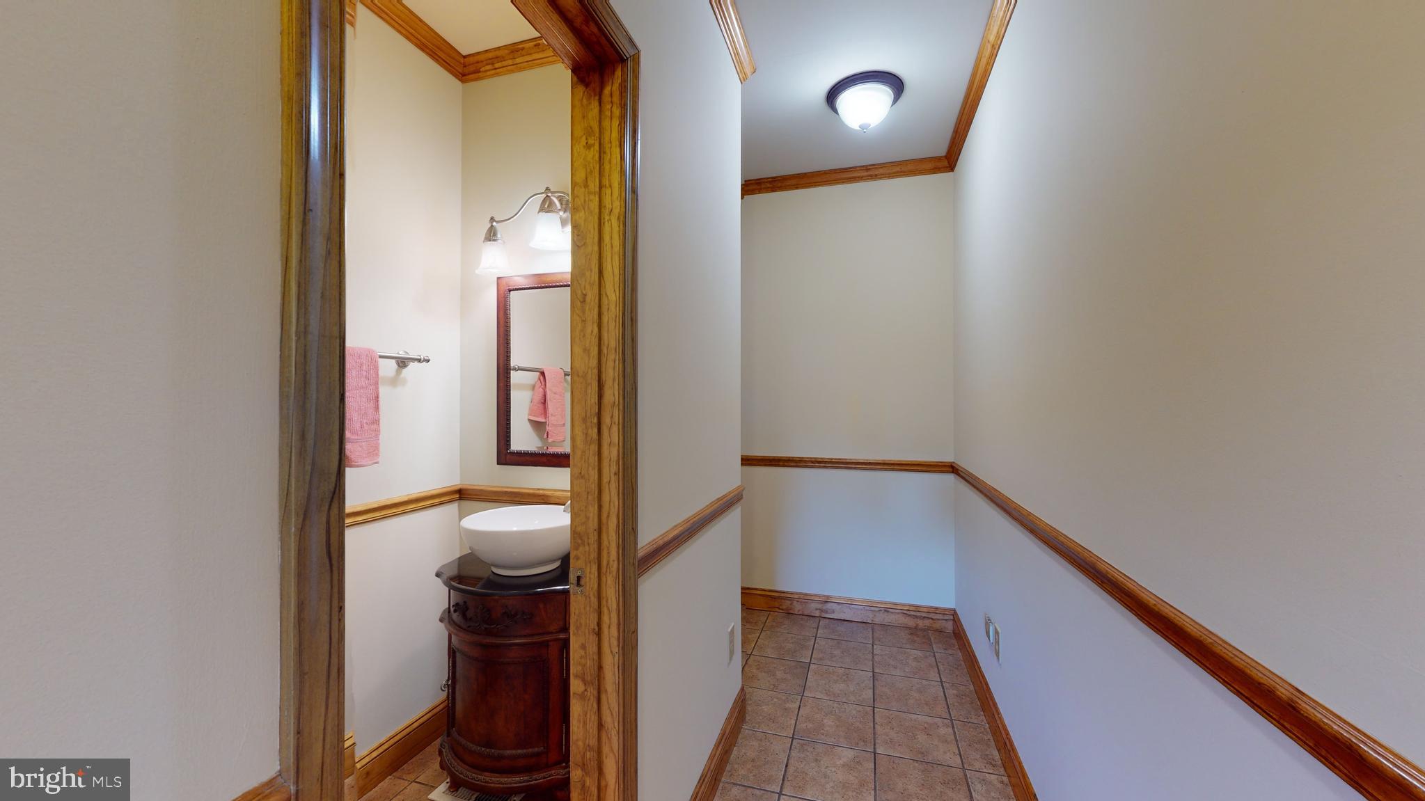 1096 CCC Road Linden, VA 22642 - Photo 19 of 45 Half bath & hallway that leads to owner's suite
