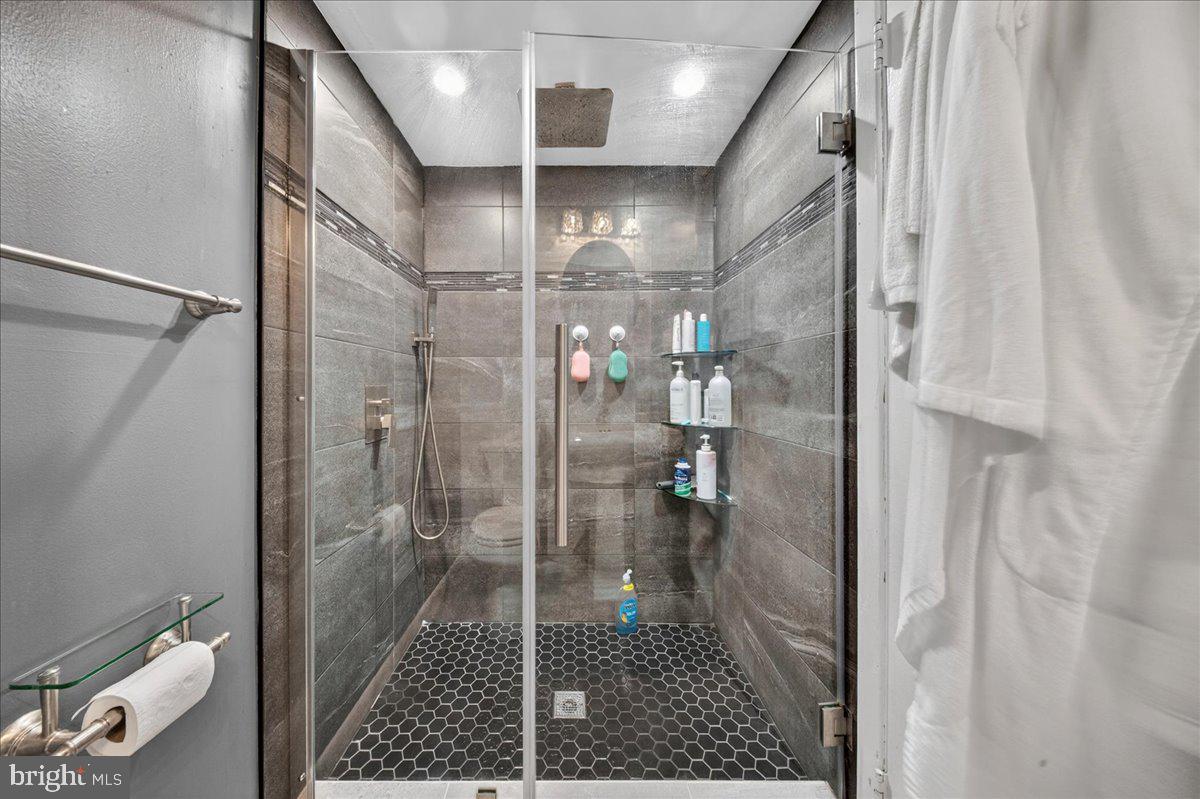 8930 Krewstown Road, Unit 310 Philadelphia, PA 19115 - Photo 20 of 32 a bathroom with a shower