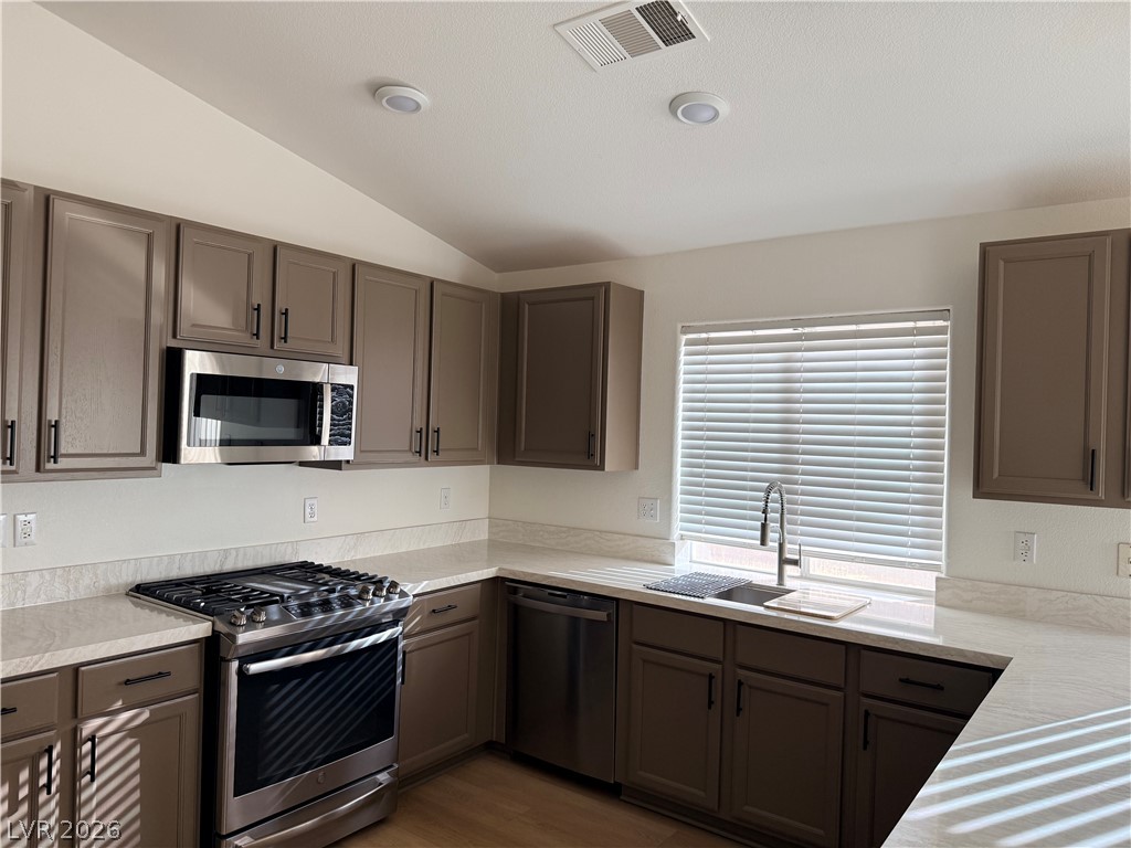 2122 Hidden Ranch Terrace Henderson, NV 89052 - Photo 9 of 20 A well-equipped kitchen features sleek appliances and ample counter space for culinary endeavors.