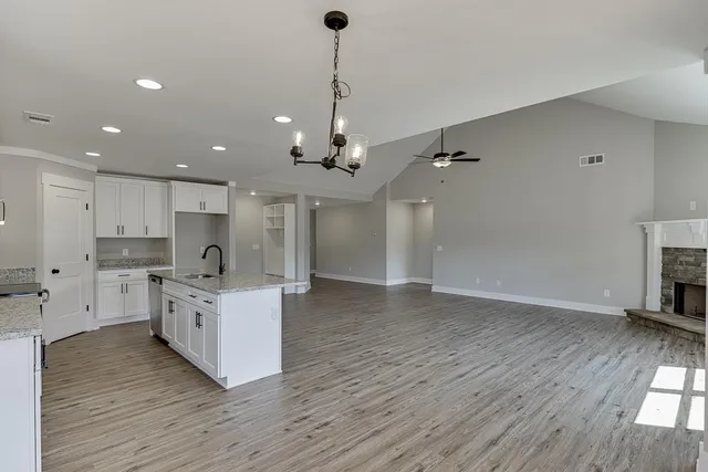 a large kitchen with stainless steel appliances kitchen island a large island in the center