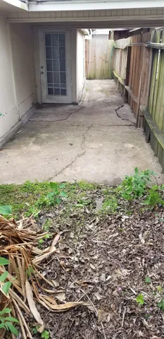 a view of a car garage with a small barn