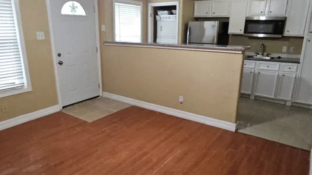 a view of a kitchen with electric appliances