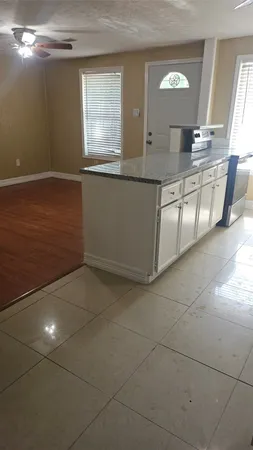 a view of a kitchen with a sink