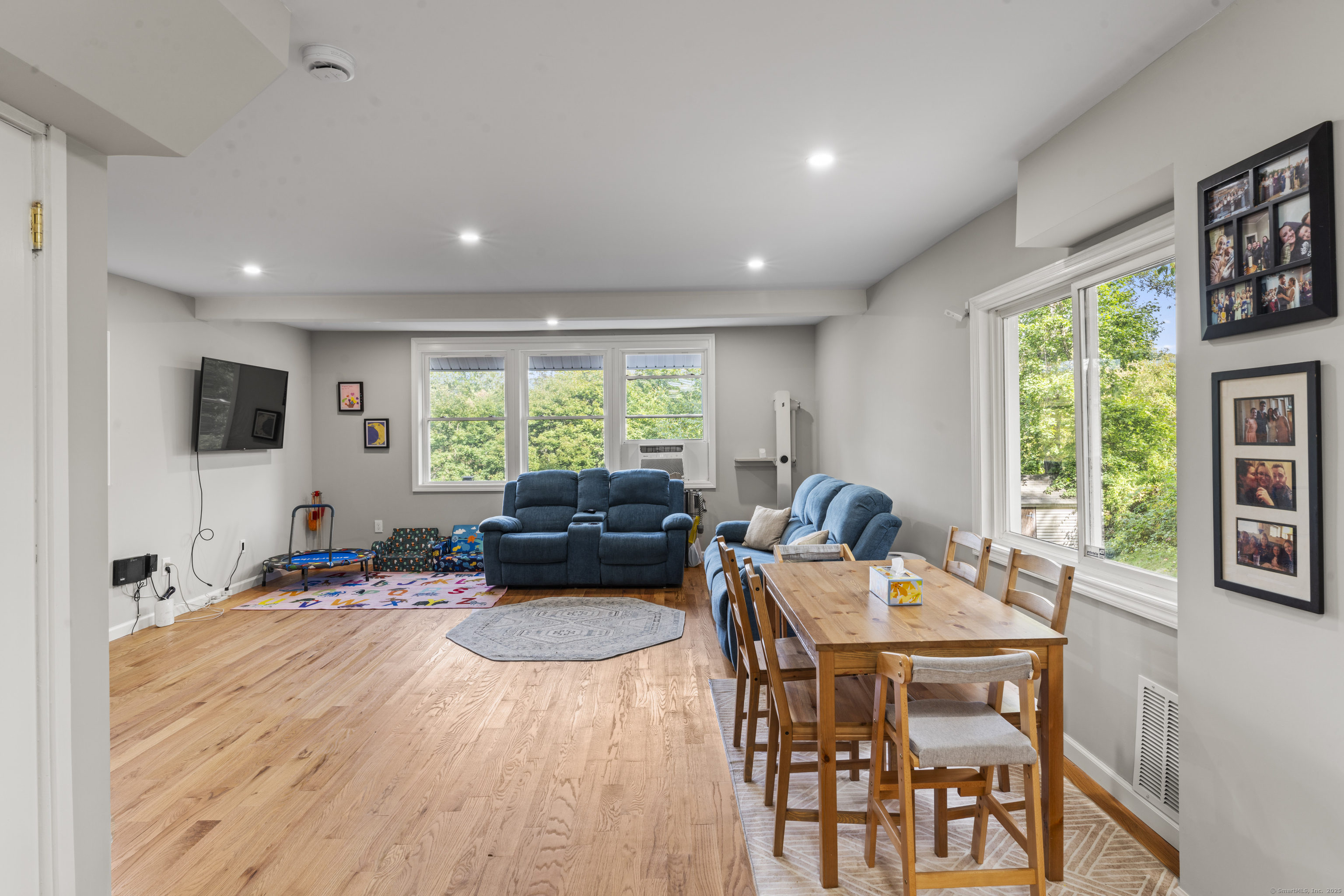 199 Riverside Road Newtown, CT 06482 - Photo 14 of 28 a living room with furniture and a flat screen tv
