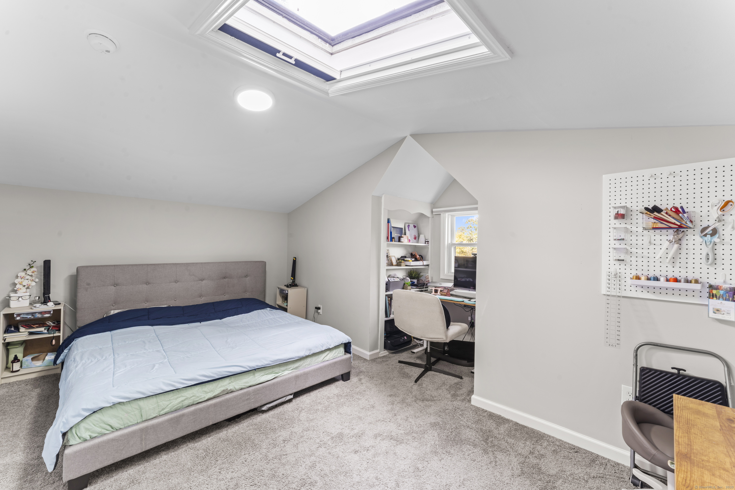 199 Riverside Road Newtown, CT 06482 - Photo 18 of 28 a bedroom with a bed and a desk