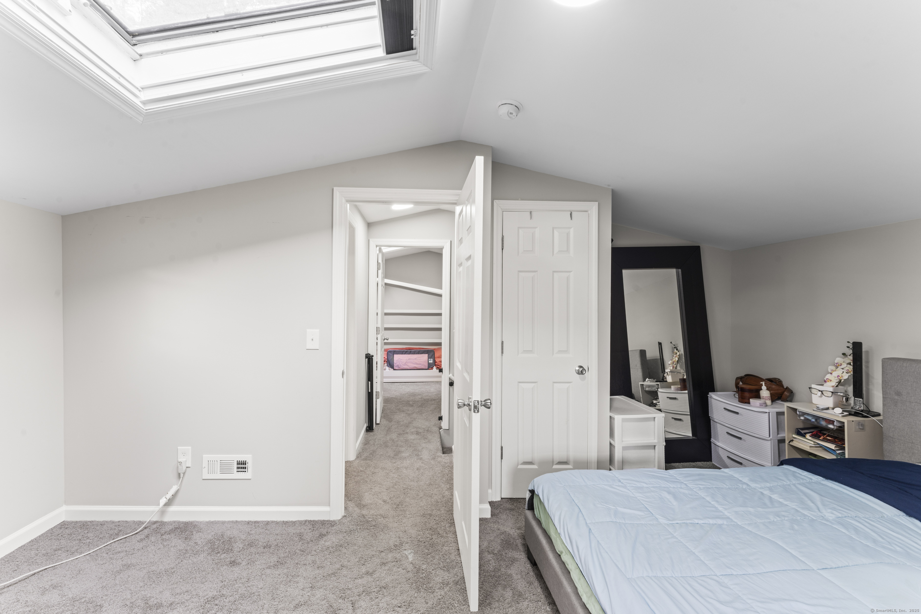 199 Riverside Road Newtown, CT 06482 - Photo 20 of 28 a view of a bedroom with a furniture and closet