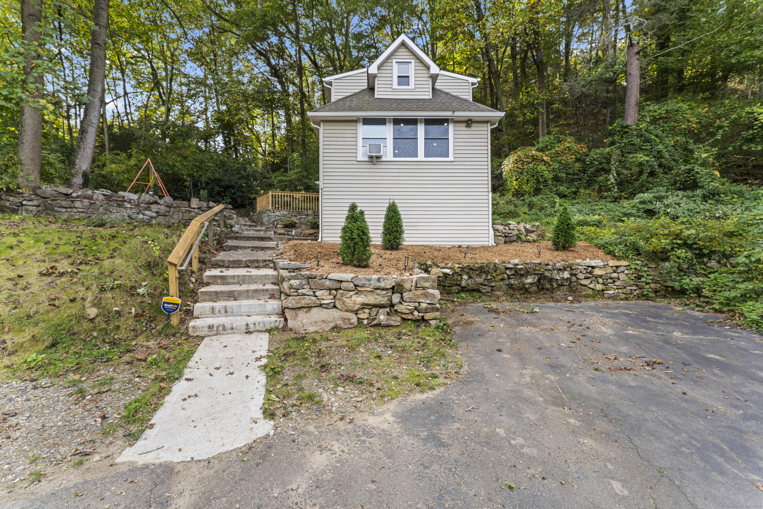199 Riverside Road Newtown, CT 06482 - Photo 27 of 28 a front view of a house with a yard