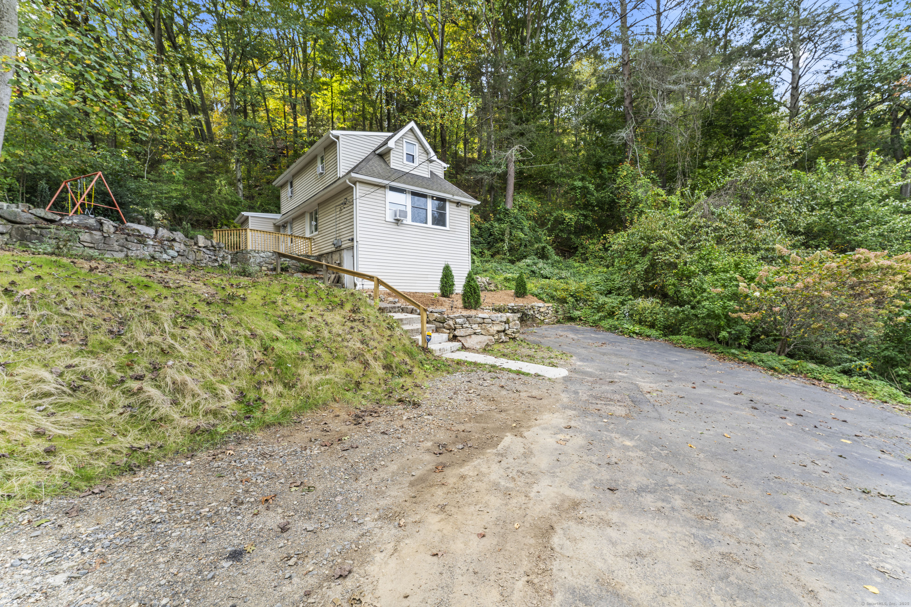 199 Riverside Road Newtown, CT 06482 - Photo 28 of 28 a aerial view of a house with a yard and large trees