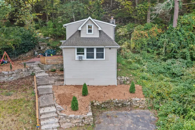 a front view of a house with garden