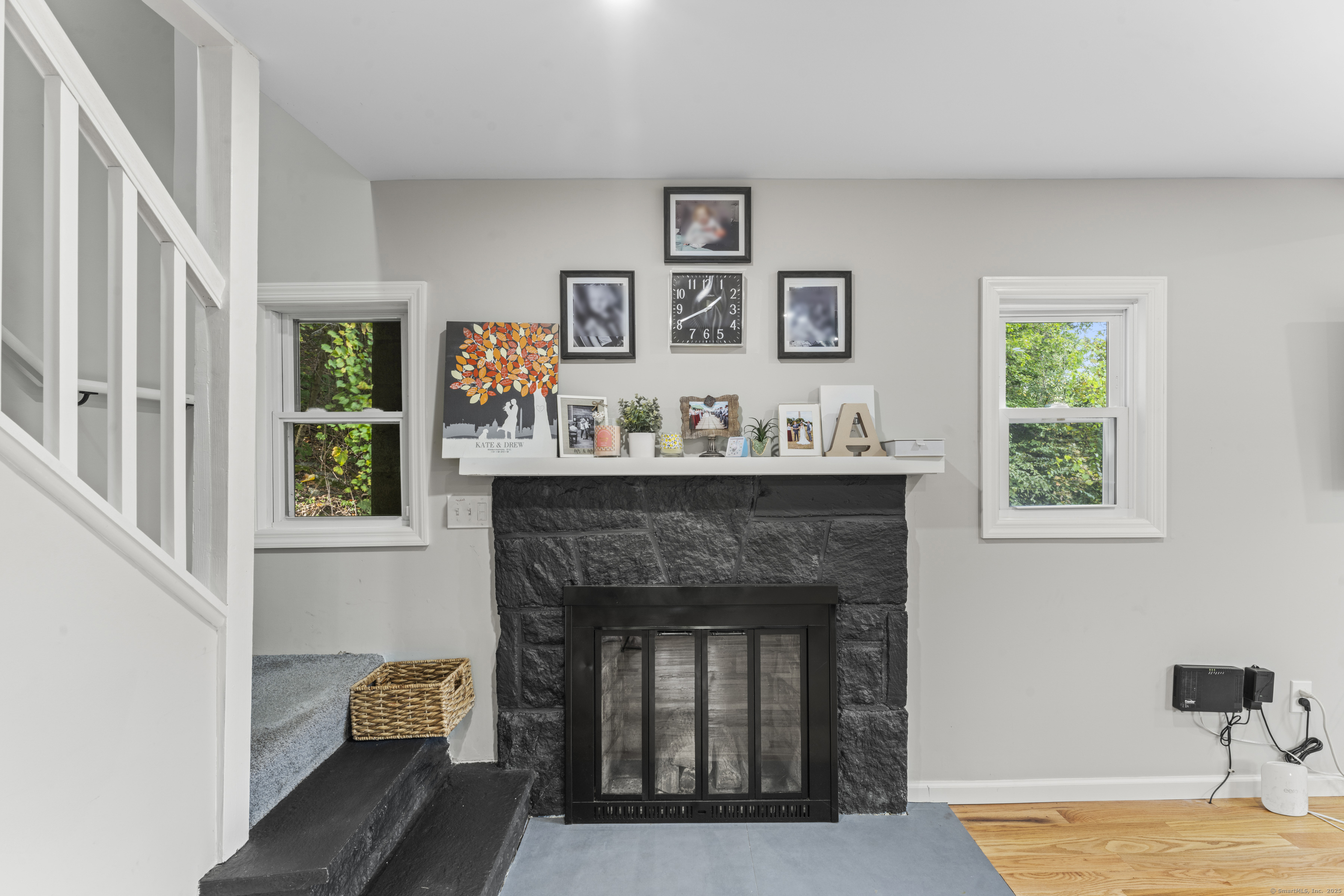 199 Riverside Road Newtown, CT 06482 - Photo 5 of 28 a living room with furniture and a fireplace