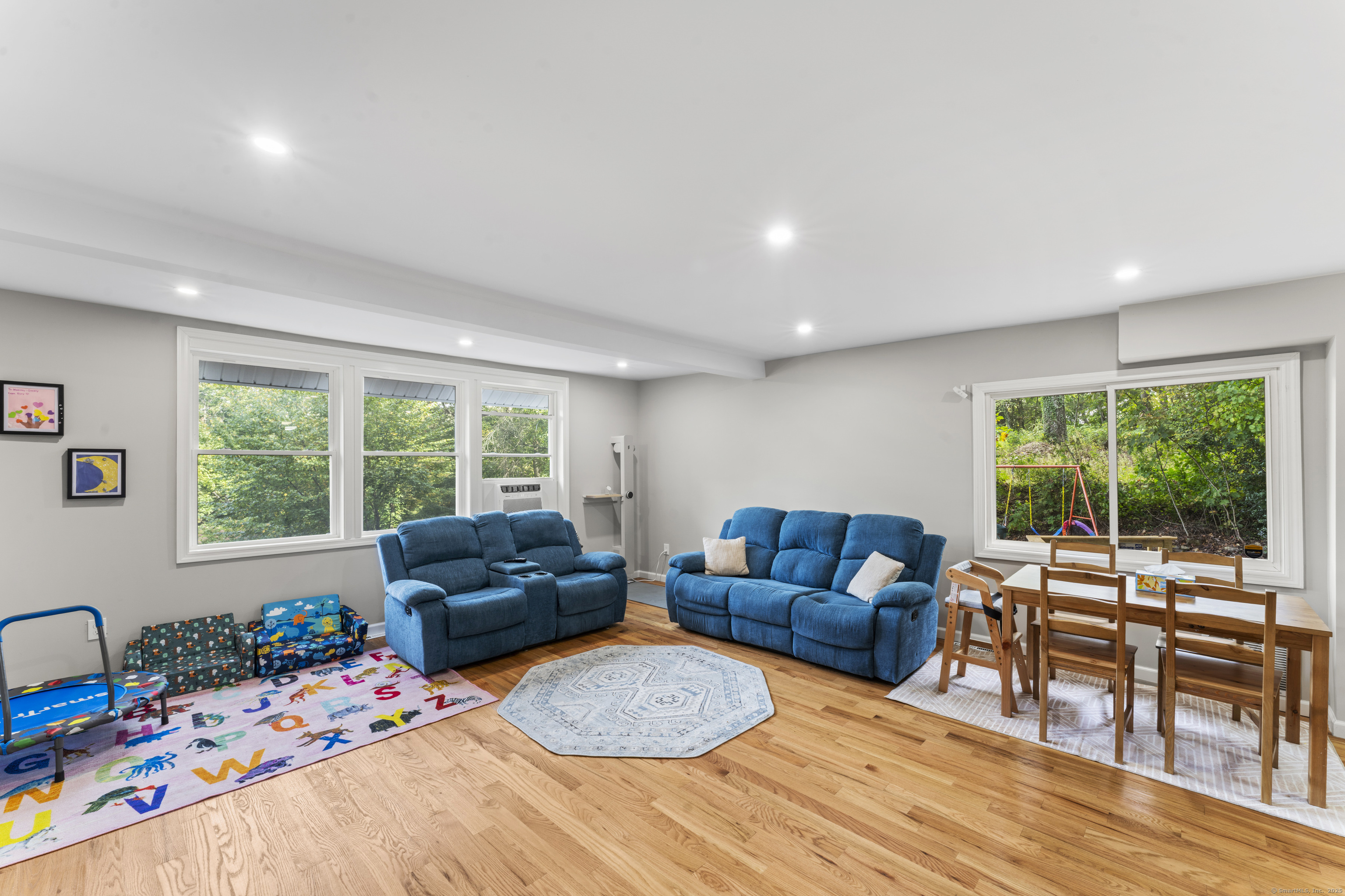 199 Riverside Road Newtown, CT 06482 - Photo 6 of 28 a bedroom with furniture and a large window